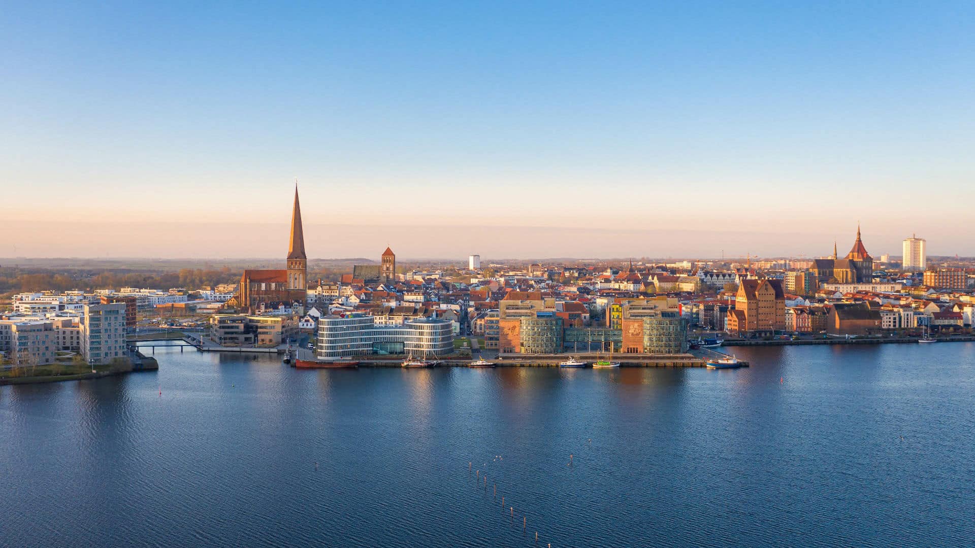 Sunrise over the city of rostock germany